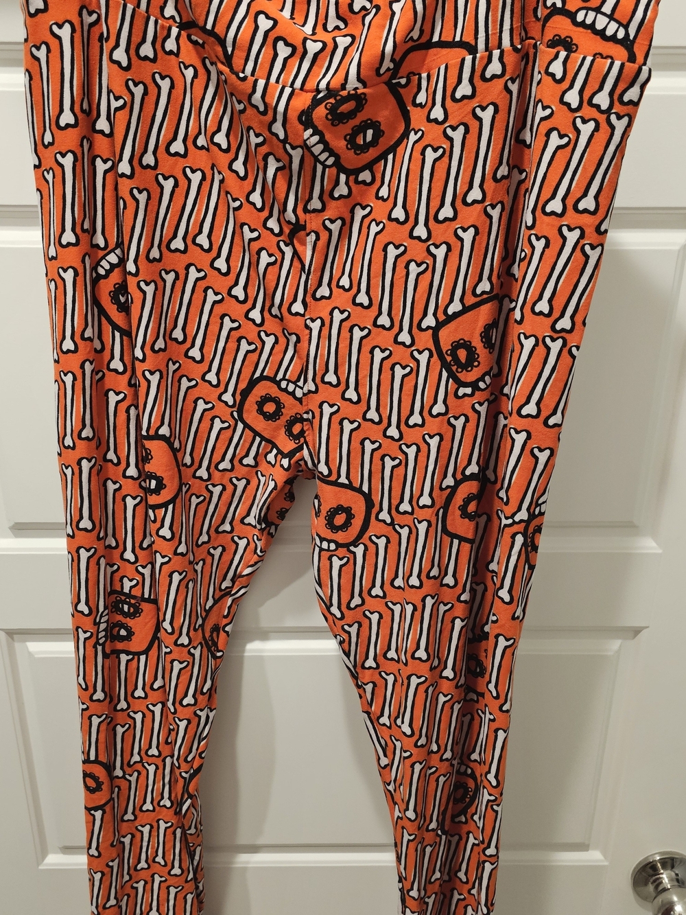 LuLaRoe Orange Leggings with White Bones and Black Skulls
